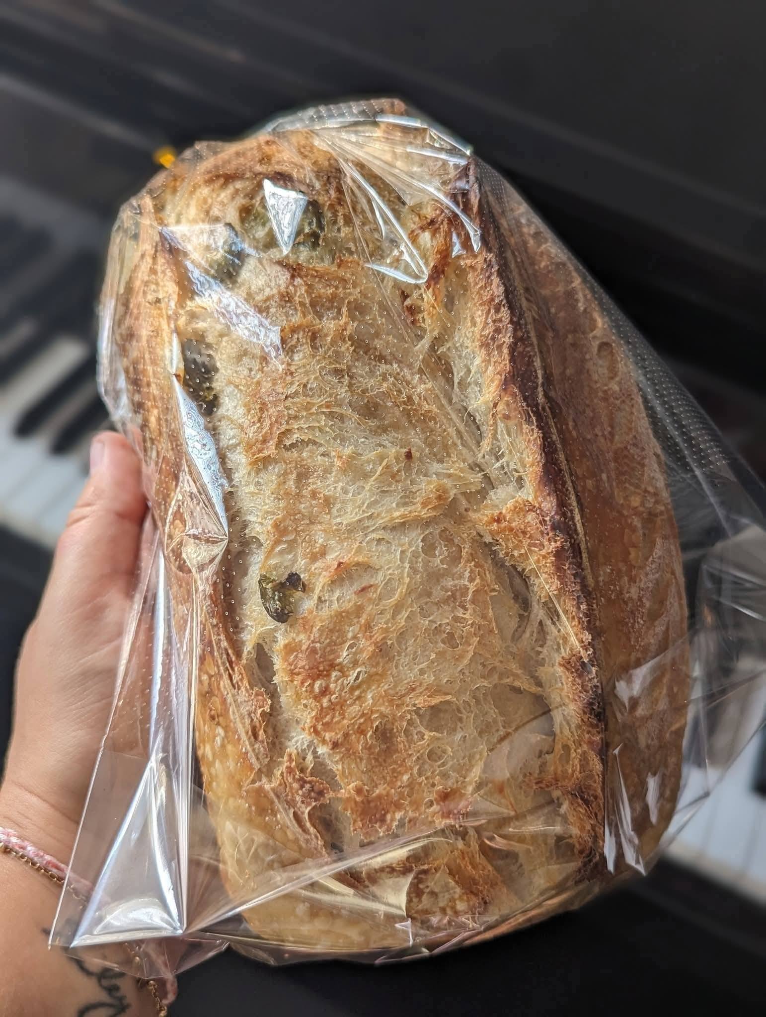 Jalape&ntilde;o cheddar sourdough loaf, bagged for pickup